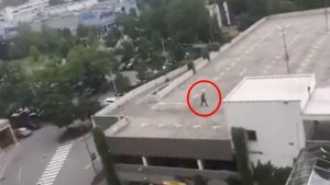 Shooter Ali David Sonboly on the rooftop of a nearby car park. Photo: YouTube