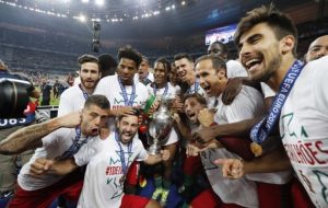 No more hissy fits: after swapping jerseys with the defeated French, Portugal poses for a victory shot. Photo: REUTERS